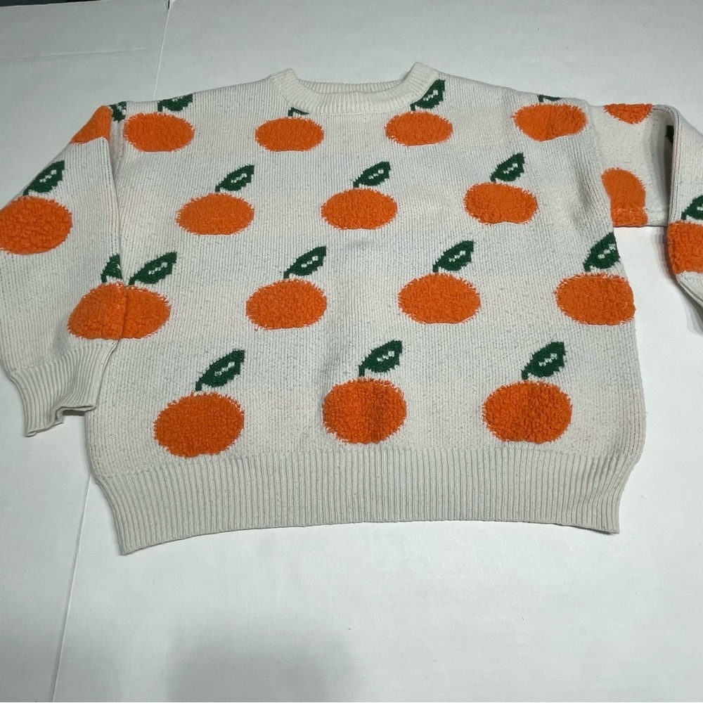 Oranges motif women’s Sweater. Size Small. Preowned.